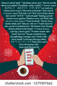2020 Happy New Year greeting message in different languages sent from the smartphone held in hands, forming a word cloud. Top view on the red table with cup of coffee on it, covered with snowflakes.