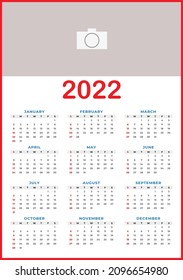 2022 Calendar. 2022 Year Wall Calendar in English. 12-month template, red outline and space for photo or banner. Use for printing, editing and wall hanging. EPS 10 vector