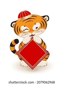 2022 Chinese new year, year of the tiger. Cute little tiger cub wearing traditional asian hat, winking, sitting and holding blank red blessing card for your text. Vector illustration, design element