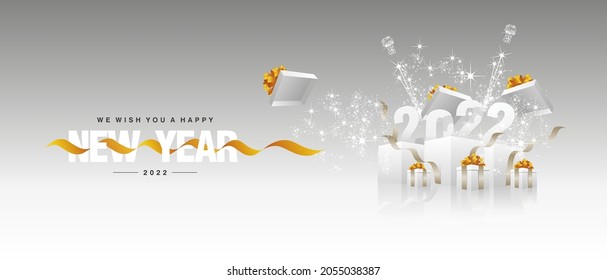 2022 Happy New Year orange yellow ribbon white sparkle firework light gift boxes silver grey background landscape greeting card