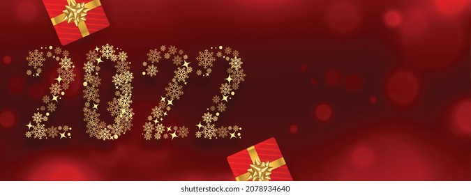 2022 new year red banner made with  golden snowflakes with gift boxex