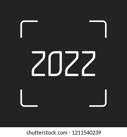2022 number icon. Happy New Year. White object in camera autofocus on dark background
