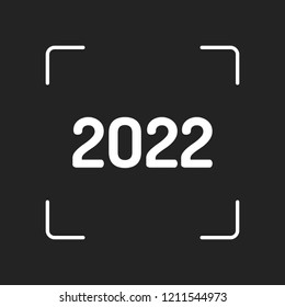 2022 number icon. Happy New Year. White object in camera autofocus on dark background