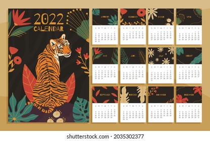 2022 year calendar concept with  hand drawn illustrations of tiger and jungle leaves.