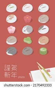 2023 Japanese New Year's card template. Vector illustration of traditional Japanese sweets in the shape of rabbits and lucky charms.
Translation: Happy new year 2023.