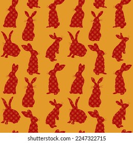 2023 Lunar New Year rabbits seamless pattern. Outlines golden rabbits on the red background. Vector isolated illustration in flat style. Perfect for textile prints, decoration, wrapping.