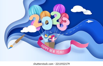 2023 New Year design greeting card with kids in basket of air balloons flying on blue sky background with brush. Vector paper art illustration. Paper cut and craft style.