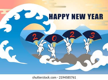 2023 New Year's card with a rabbit dancing with a folding fan in the rough sea where Mt. Fuji can be seen in the distance.