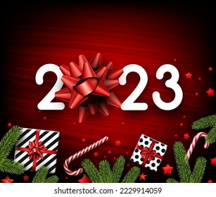 2023 sign with red bow on red background. Stars confetti, fir, candy canes.