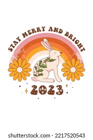 2023 is the year of the rabbit. Christmas retro greeting card with groovy rabbit, rainbow and holiday objects. Lettering quote in 70s style. Vector illustration for postcard, poster, invitation etc.