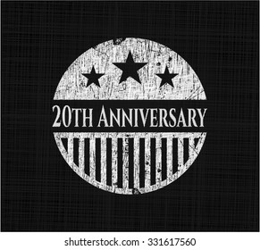 20th Anniversary chalk emblem written on a blackboard