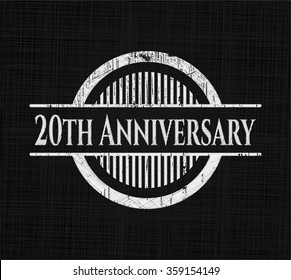 20th Anniversary chalk emblem written on a blackboard