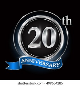20th anniversary logo with silver ring and blue ribbon.