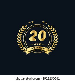 20th golden anniversary logo, with shiny ring and golden ribbon, laurel wreath isolated on navy blue background