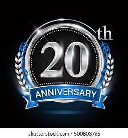 20th silver anniversary logo with blue ribbon and ring.