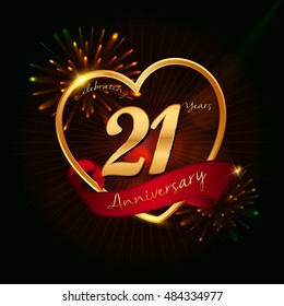 21 years anniversary logo golden colored,with love shape, red ribbon, and fireworks background