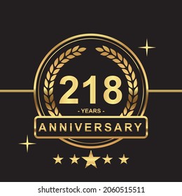 218 years anniversary golden color with circle ring and stars isolated on black background for anniversary celebration event luxury gold premium vector