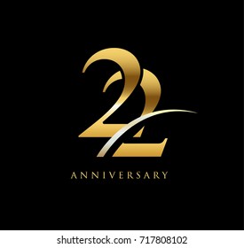 22 anniversary elegance gold logo. linked number with swoosh on black background