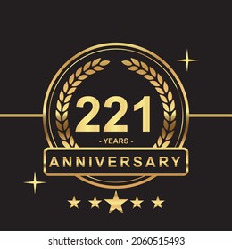 221 years anniversary golden color with circle ring and stars isolated on black background for anniversary celebration event luxury gold premium vector