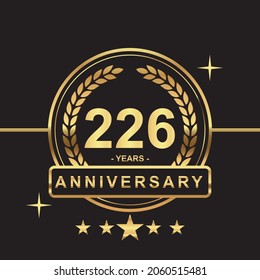 226 years anniversary golden color with circle ring and stars isolated on black background for anniversary celebration event luxury gold premium vector