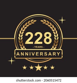 228 years anniversary golden color with circle ring and stars isolated on black background for anniversary celebration event luxury gold premium vector