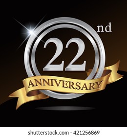 22nd anniversary logo, with shiny silver ring and gold ribbon isolated on black background. vector design for birthday celebration.