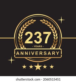 237 years anniversary golden color with circle ring and stars isolated on black background for anniversary celebration event luxury gold premium vector