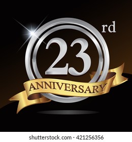 23rd anniversary logo, with shiny silver ring and gold ribbon isolated on black background. vector design for birthday celebration.