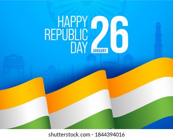 26 January Happy Republic Day Text With Wavy Tricolor Ribbon On India Famous Monument Blue Background.