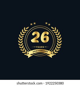 26th golden anniversary logo, with shiny ring and golden ribbon, laurel wreath isolated on navy blue background