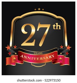 27 years golden anniversary logo celebration with ring and ribbon.