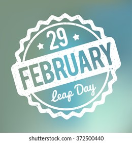 29 February Leap Day rubber stamp white on a blue bokeh fog background.