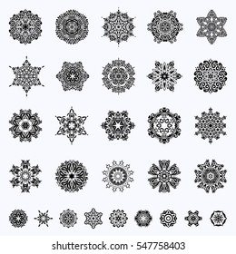 29 snowflakes set in abstract style. New Year 2017-2018 collection. Freehand ethnic Xmas sketch. Ornamental artistic vector illustration on neutral background for Merry christmas cards.