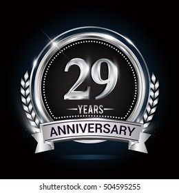 29 years silver anniversary logo with laurel wreath, ribbon and silver ring. vector design