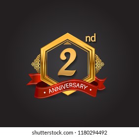 2nd anniversary design logotype style with golden hexagon, ornament and red ribbon for use in celebration event.