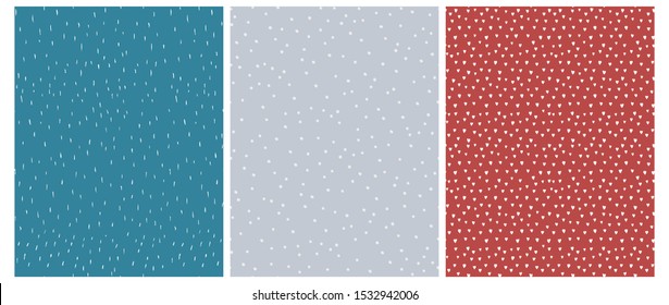 3 Cute Abstract Geometric Vector Patterns.White, Blue and Red Color Design. Brushed Raindrops on a Blue Background. Irregular White Dots on a Gray. Romantic Print With White Hearts Isolated on a Red.