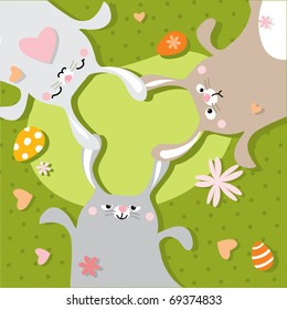 3 cute Easter bunnies on green spring background