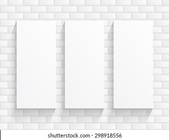 3 rectangular boards blanks sheet of paper on a brick wall background