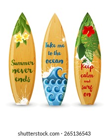 3 wooden surfboards with prints and different type designs