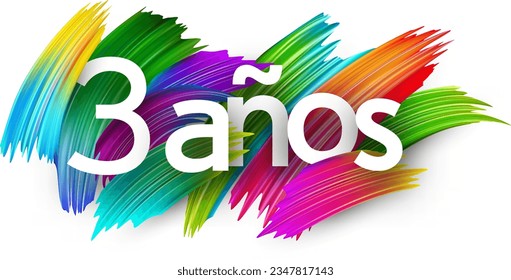 3 years at spanish paper word sign with colorful spectrum paint brush strokes over white. Vector illustration.