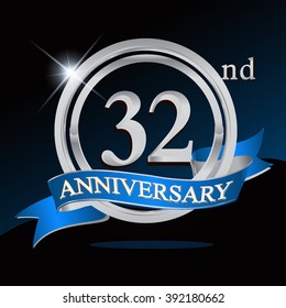 32nd anniversary logo with blue ribbon and silver ring, vector template for birthday celebration.