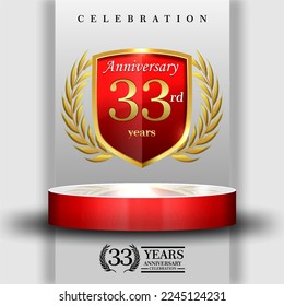 33 years gold anniversary celebration logo with 3d red cylinder podium , isolated on grey background