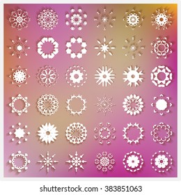 36 Universal different round ornaments, logo icon label design elements set. White symbols stylized flowers, stars or snowflakes. Abstract geometric shapes collection on purple blurred background