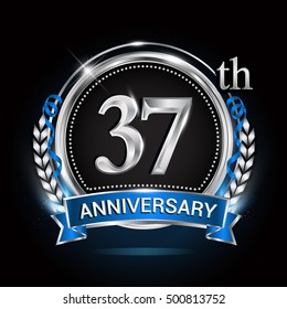 37th silver anniversary logo with blue ribbon and ring.