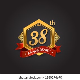 38th anniversary design logotype style with golden hexagon, ornament and red ribbon for use in celebration event.