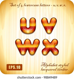 3d Joyful Decorative lacquer set of 4 lowercase letters "u", "v", "w", "x" alphabet styled expensive wood. Eps 10.