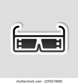 3D movie glasses. Icon of cinema technology. Sticker style with white border and simple shadow on gray background