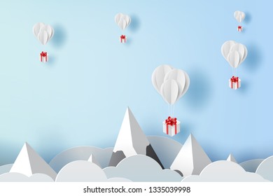 3D paper art and craft of balloon white floating on sky,Balloon with Gift Box Floating on air blue background,happy new years and merry Christmas,Festival concept,landscape snowy mountain.vector