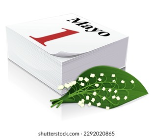 3D paper diary on the page of May Day written in Spanish with a sprig of lily of the valley next to it, a symbol of May Day