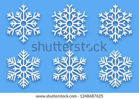 3D Vector Papercut Decorative Handmade Snowflakes Set with Soft Drop Shadow Isolated on Light Blue Background. Merry Christmas and Happy New Year Decoration Design Element
